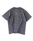 A gray oversized fit t-shirt with the brand 'MNDST' printed in white on the back.