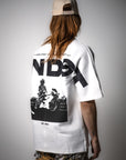 MNDST Model showcasing the back of the Immersion Tee.