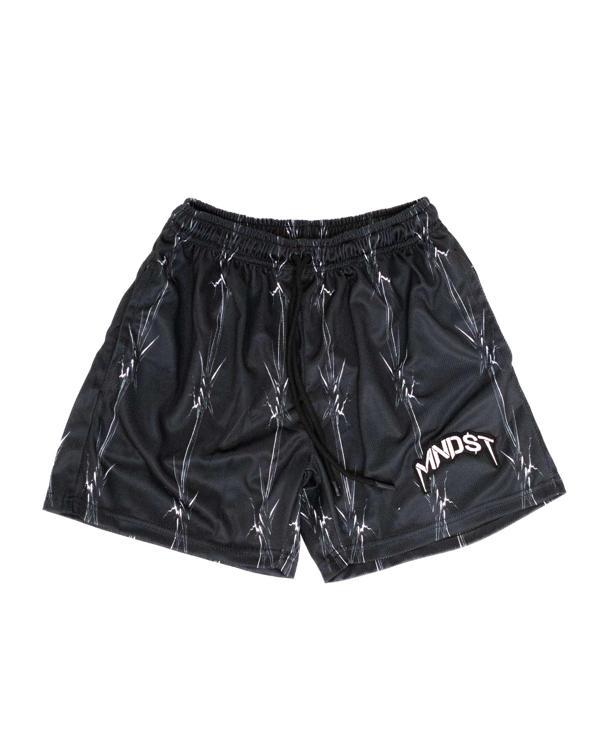 Black MNDST shorts with white barbed wire patterns on a white background