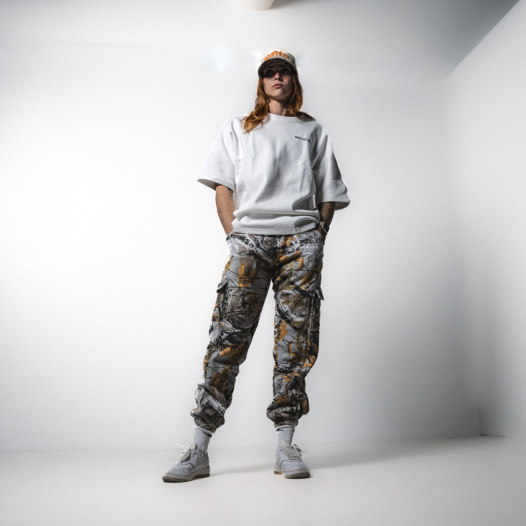 MNDST Model showcasing the Immersion Tee and Survival Joggers