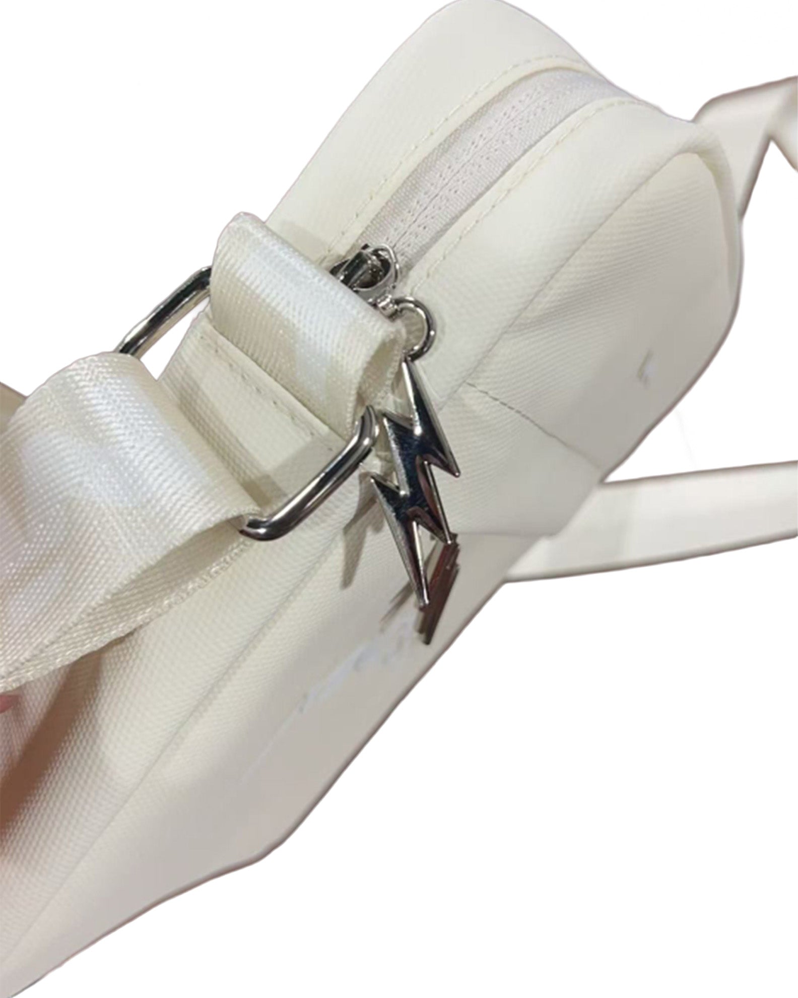 Close-up of the MNDST BoltPak - Bone White with its Lightning bolt zippers