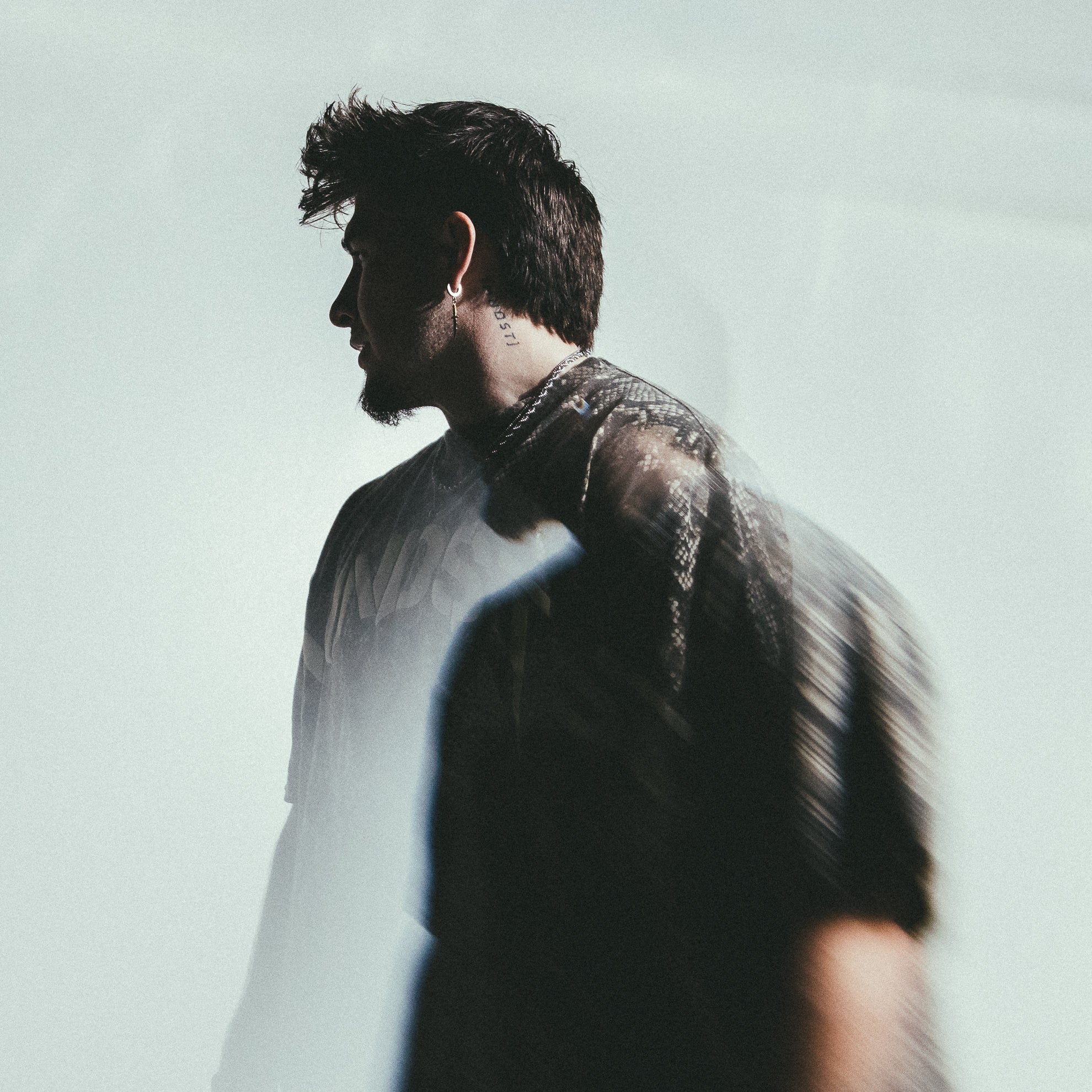 MNDST model posing with new MNDST shirt, with unique camera effects 